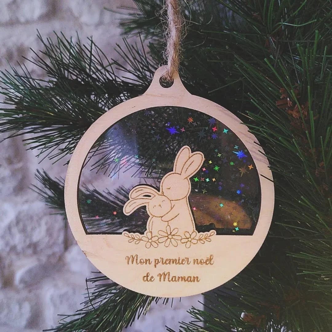 Aperçu 1 : Boule de Noël lapins maman bébé fond étoilé